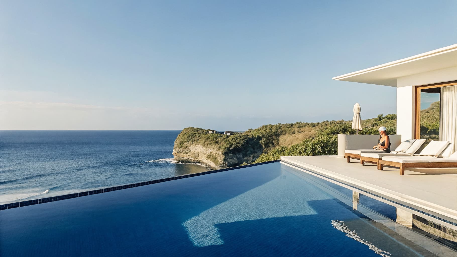 Luxury Bali villa overlooking the ocean at sunset